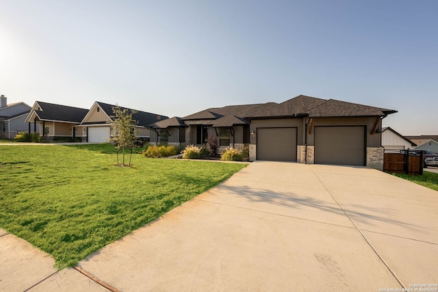 view of front facade with a front yard and a garage