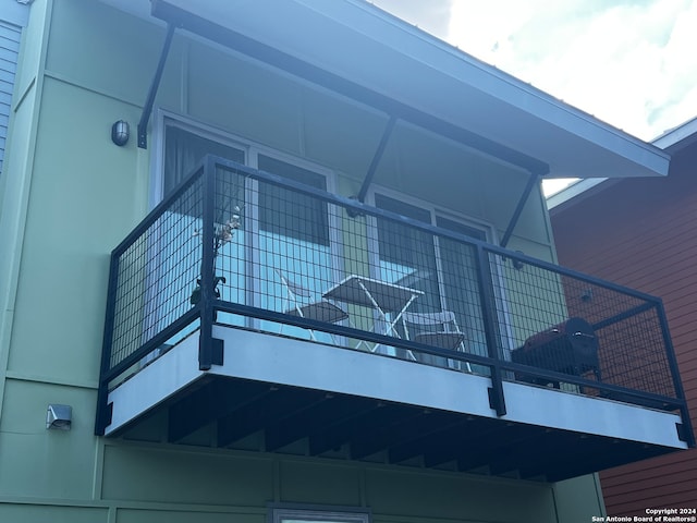 view of side of home with a balcony