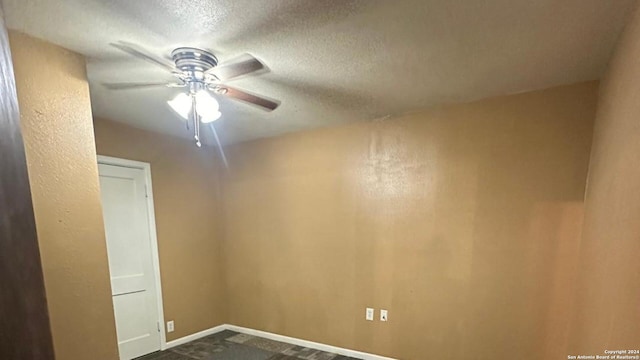 empty room featuring ceiling fan and a textured ceiling