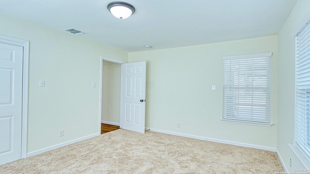 empty room with carpet flooring