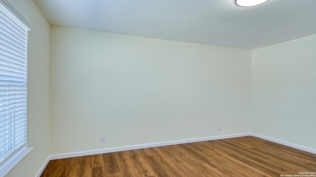 spare room featuring hardwood / wood-style flooring