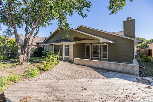 rear view of house with a deck