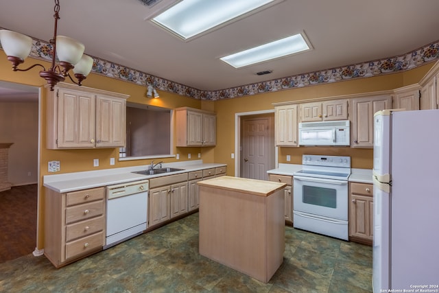 kitchen featuring white appliances, light brown cabinets, sink, wood counters, and a center island