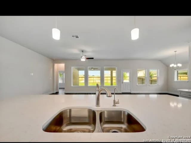 kitchen with pendant lighting, sink, and a wealth of natural light