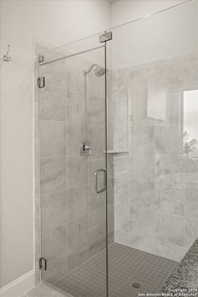 bathroom featuring an enclosed shower