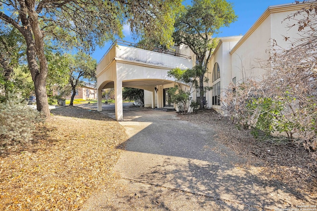 exterior space with a carport