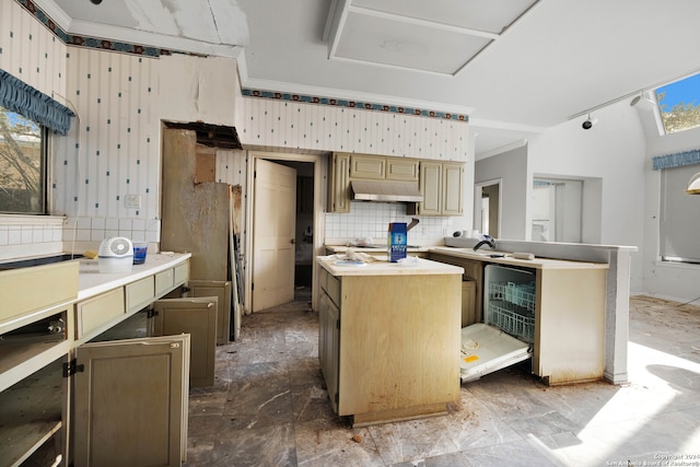 kitchen with a kitchen island, white refrigerator, crown molding, and tasteful backsplash