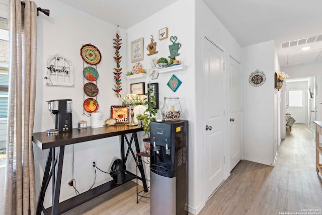 hall with light hardwood / wood-style flooring