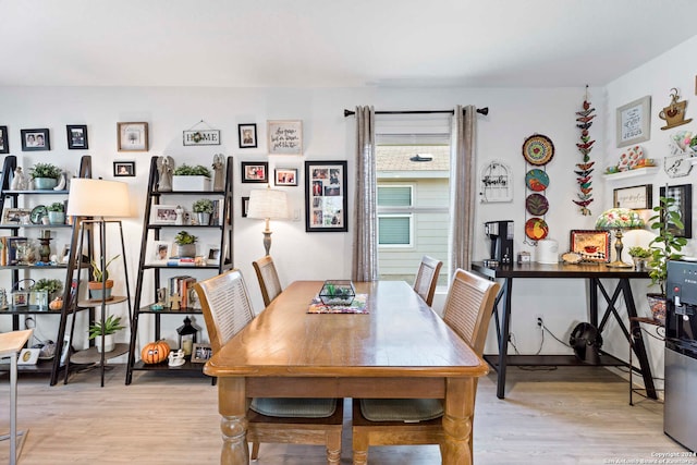 dining area with light wood-type flooring