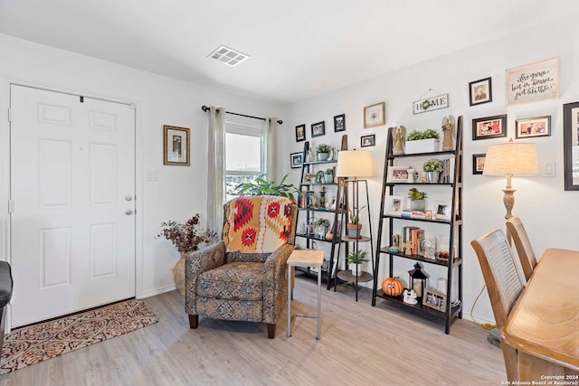 living area with light hardwood / wood-style flooring