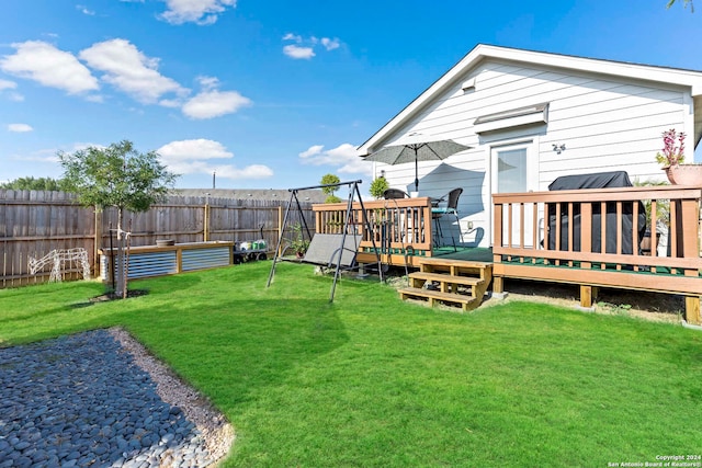 view of yard with a wooden deck