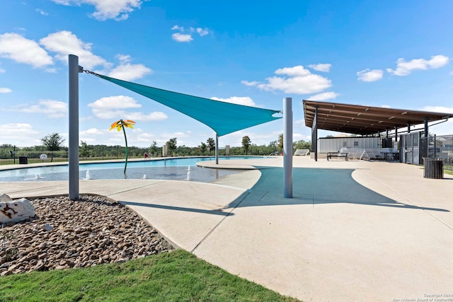 view of swimming pool featuring a patio area