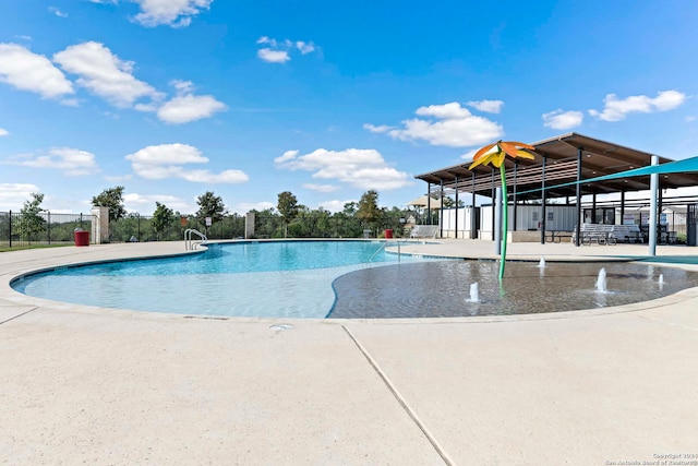 view of swimming pool featuring a patio and pool water feature