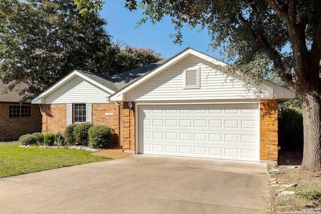 single story home featuring a front yard and a garage