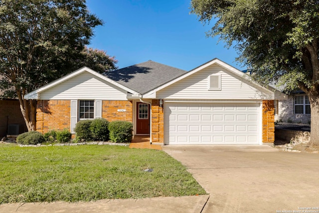 ranch-style home featuring a garage and a front yard