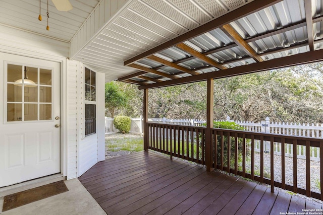 wooden deck with a fenced backyard and ceiling fan