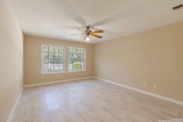 unfurnished room featuring ceiling fan