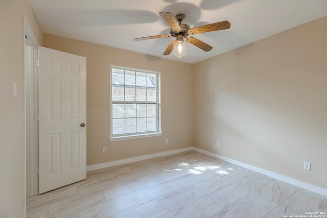 unfurnished room with ceiling fan