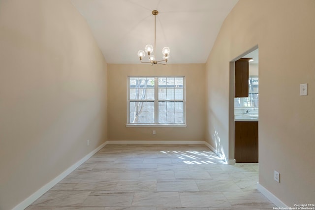 unfurnished dining area with lofted ceiling and a notable chandelier