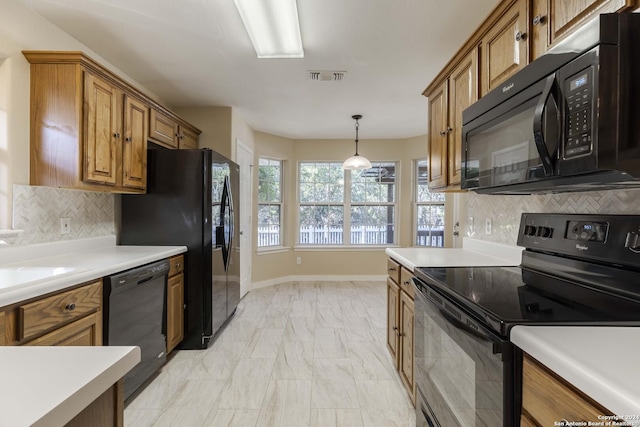 kitchen with tasteful backsplash, visible vents, marble finish floor, brown cabinets, and black appliances