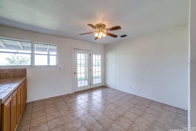 interior space featuring ceiling fan