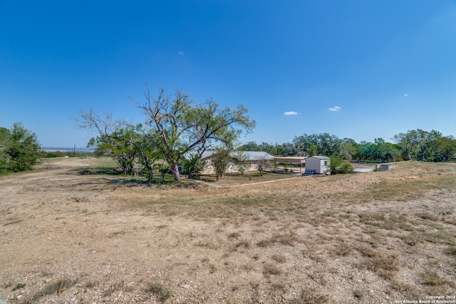 view of yard with a rural view