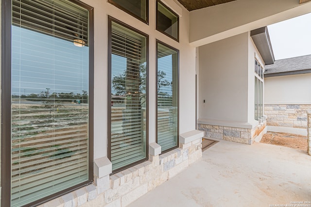 property entrance featuring a patio area