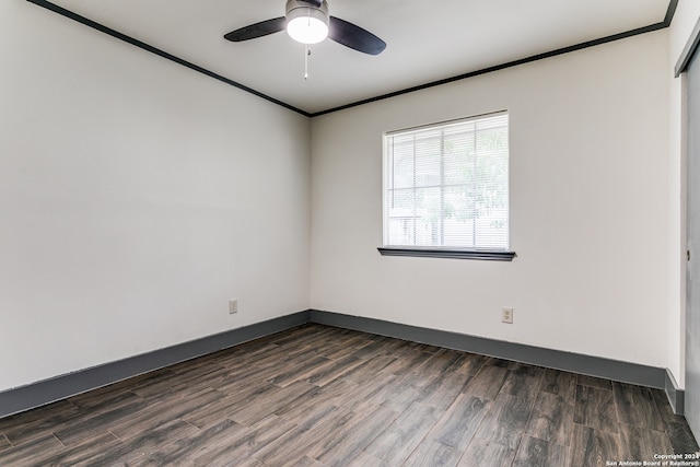 empty room with ornamental molding, ceiling fan, and dark hardwood / wood-style flooring