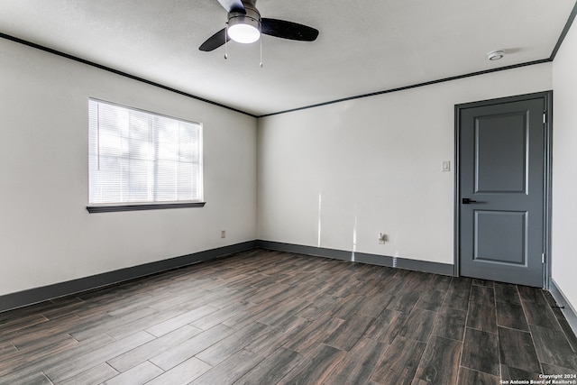 spare room featuring ceiling fan, a textured ceiling, crown molding, and dark hardwood / wood-style flooring