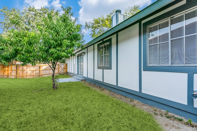 view of home's exterior with a yard