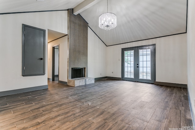 unfurnished living room featuring a fireplace, beam ceiling, french doors, and dark hardwood / wood-style flooring