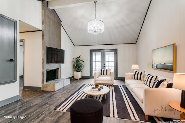 living room featuring a notable chandelier, high vaulted ceiling, a tiled fireplace, and dark wood-type flooring