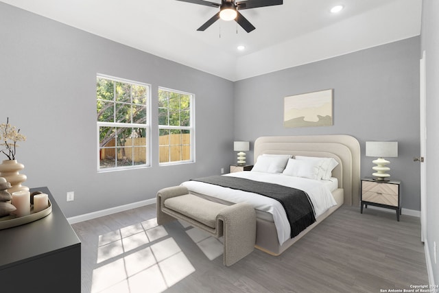 bedroom with ceiling fan and hardwood / wood-style floors