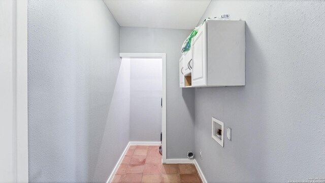 laundry room with hookup for a washing machine and baseboards