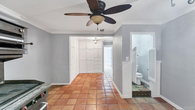 interior space featuring crown molding and baseboards