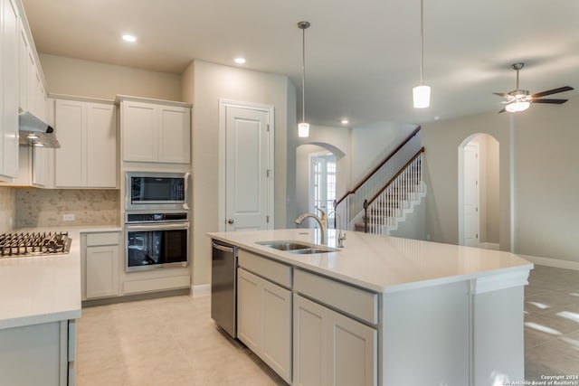 24706 Faraday, San Antonio, TX 78257 - kitchen with exhaust hood, decorative backsplash, appliances with stainless steel finishes, arched walkways, and a sink