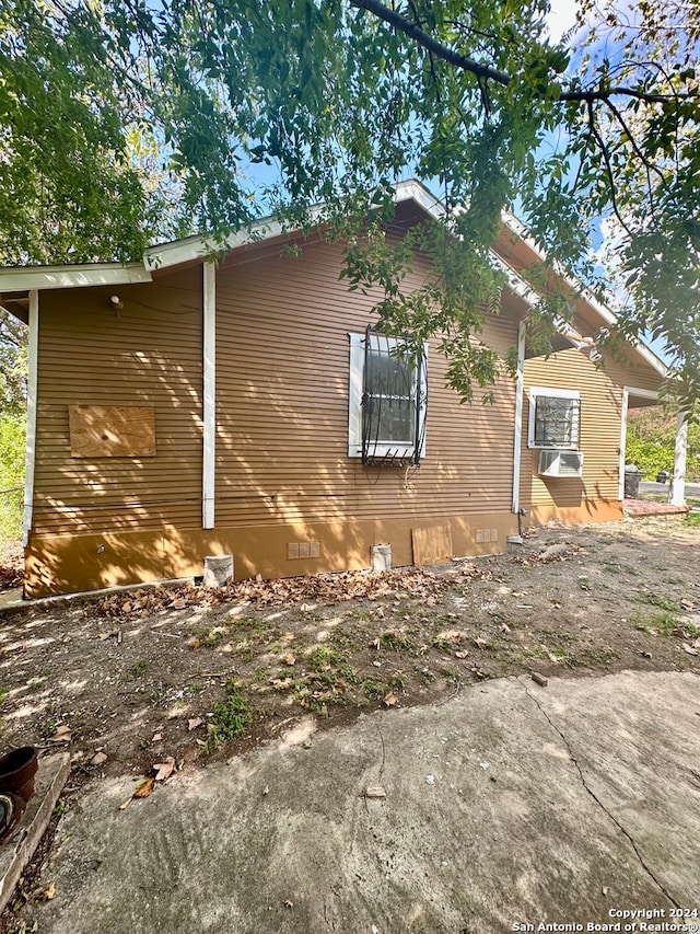 view of property exterior with cooling unit