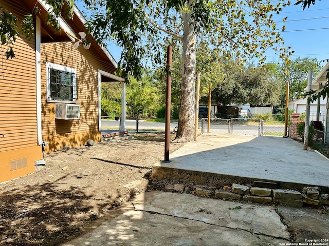 view of yard with cooling unit and a patio area