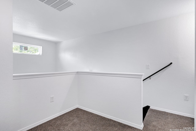 empty room featuring carpet floors