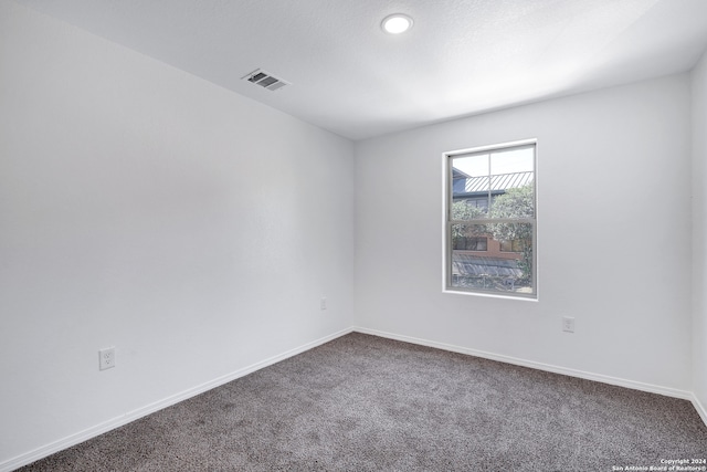 unfurnished room with carpet flooring