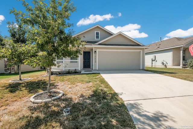 view of front of home featuring a garage and a front lawn