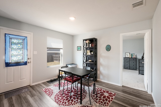 dining area featuring dark hardwood / wood-style flooring