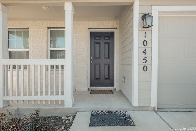 doorway to property with covered porch