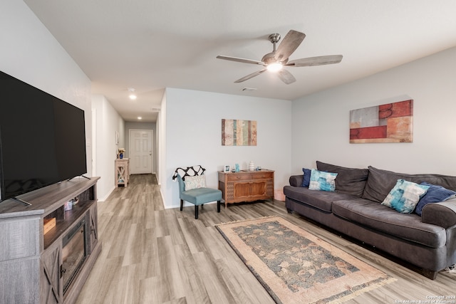 living room featuring light wood-type flooring and ceiling fan