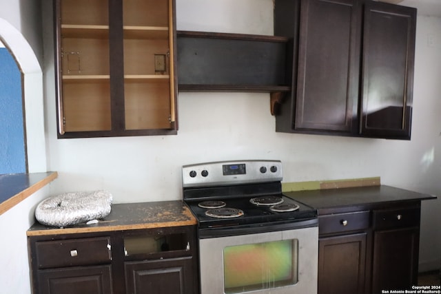 kitchen with dark brown cabinets and stainless steel range with electric stovetop