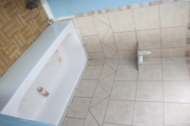 bathroom featuring a bathtub and tile patterned floors