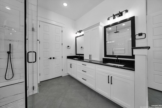 bathroom featuring vanity, tile patterned floors, and an enclosed shower