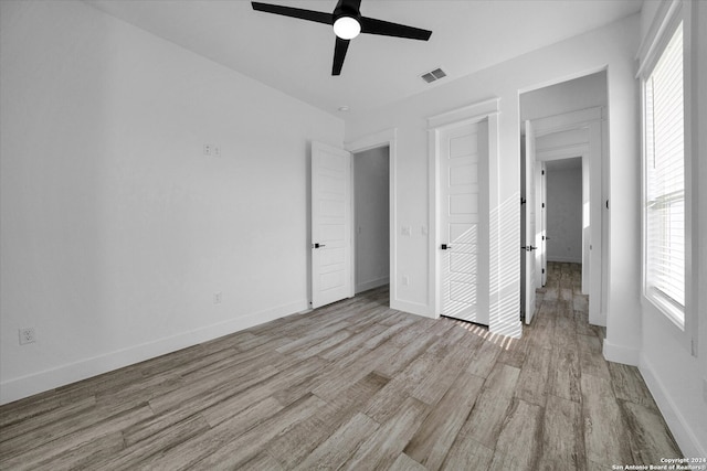 unfurnished bedroom featuring light hardwood / wood-style floors and ceiling fan