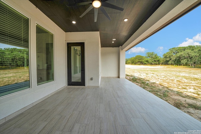 view of patio featuring ceiling fan