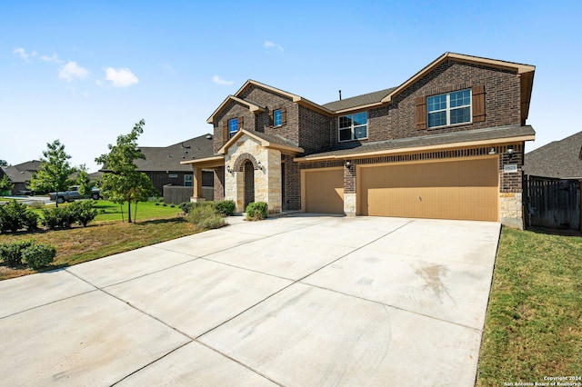 craftsman-style house featuring a garage and a front lawn